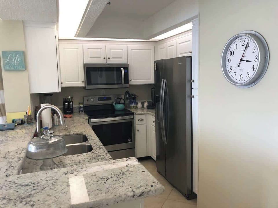 Remodeled Kitchen with Granite counter tops and and Stainless steel appliances