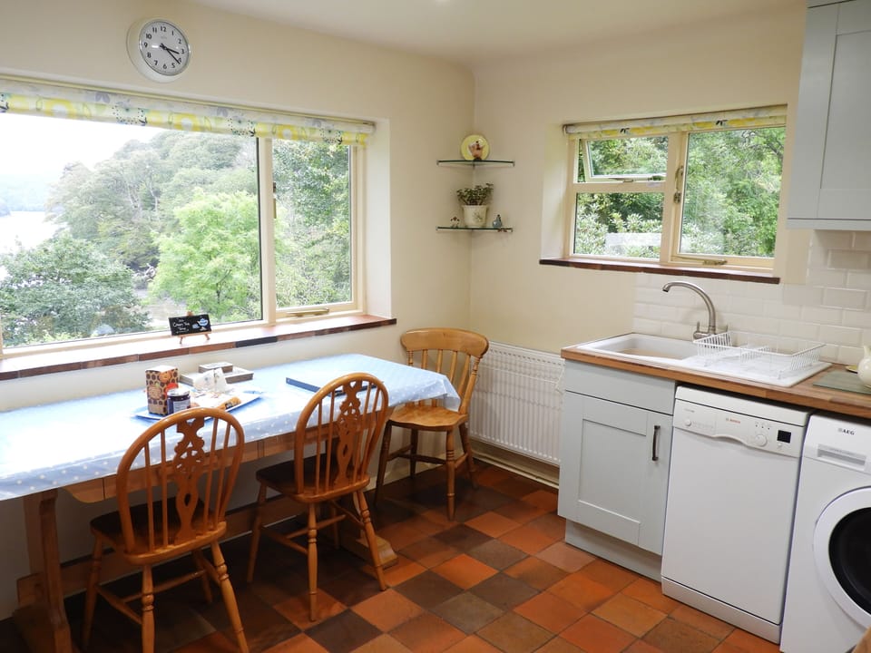 Large picture window in the kitchen/diner looks down towards the river