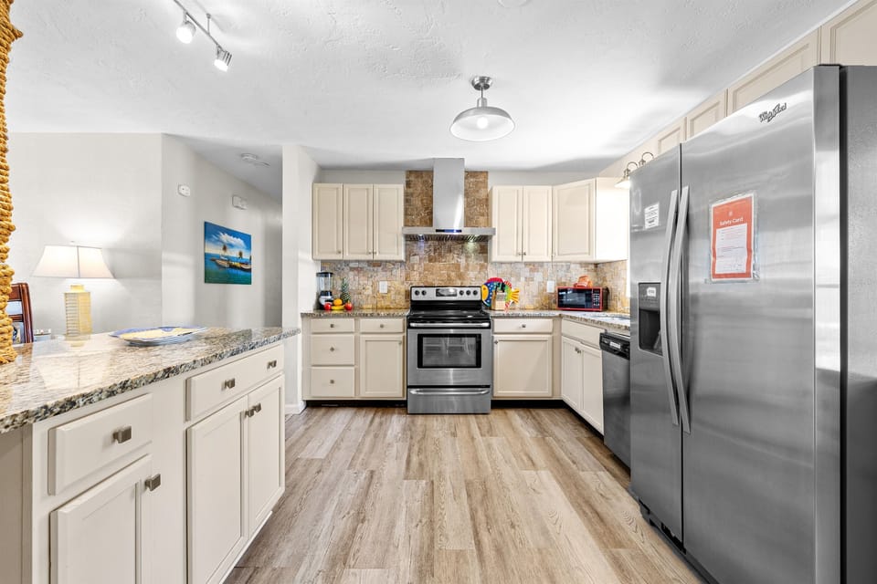 Kitchen with cookware, dishes and utensils for 10!   Kitchen includes coffee, paper towels and starter set of Dishwasher detergent.