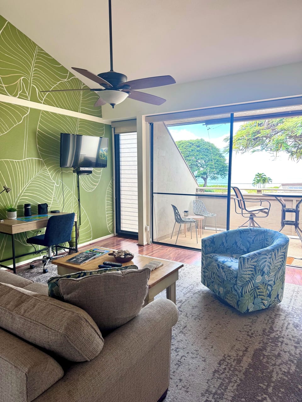 Floor to ceiling tropical living room mural. 
