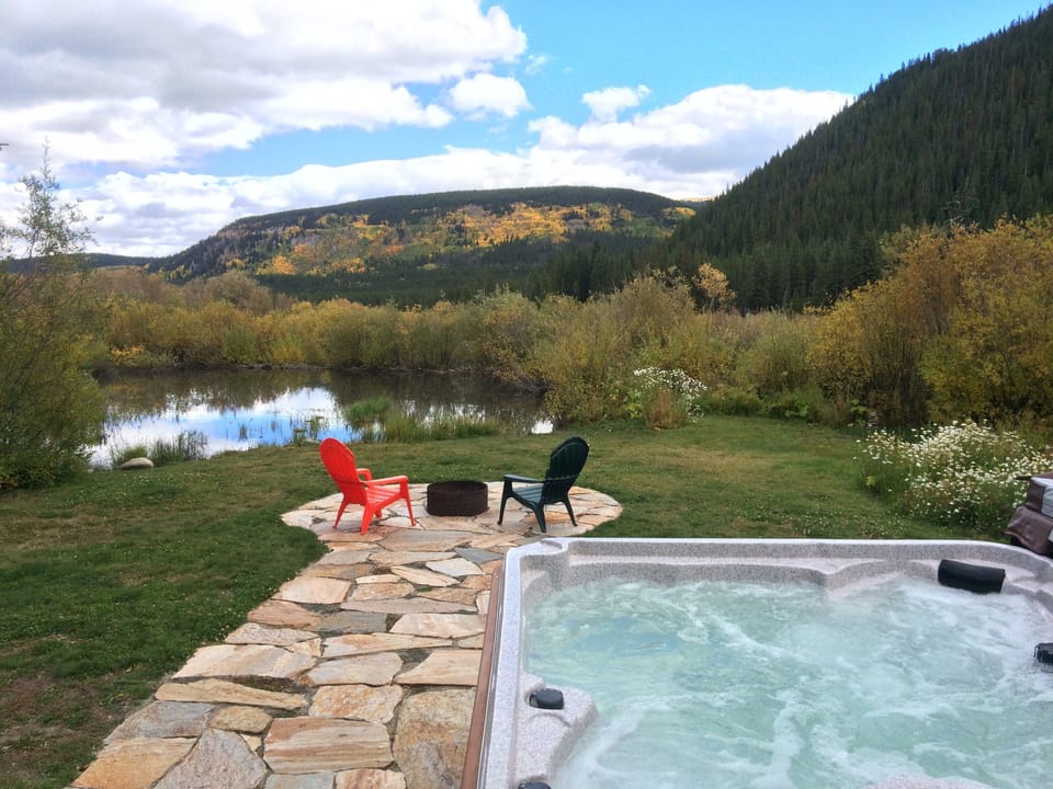 Our backyard boasts a hot tub, fire pit, stream, and amazing views!