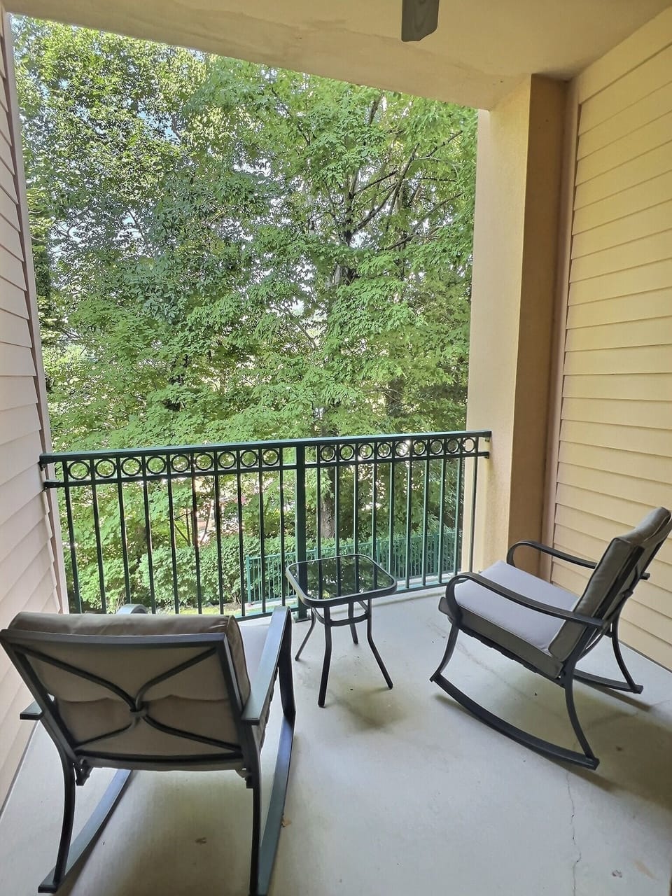 Private Balcony off the master bedroom with a table and 2 chairs