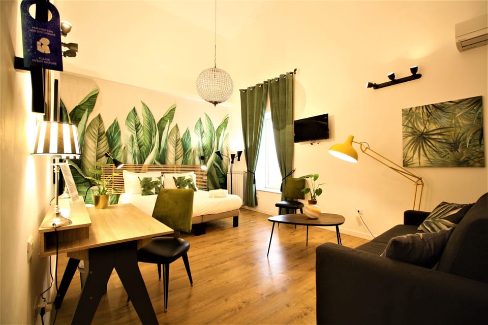 Premium Quadruple Room | Minibar, desk, laptop workspace, blackout drapes