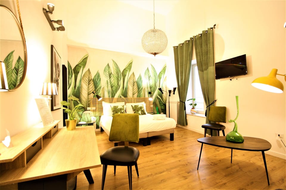 Premium Quadruple Room | Minibar, desk, laptop workspace, blackout drapes