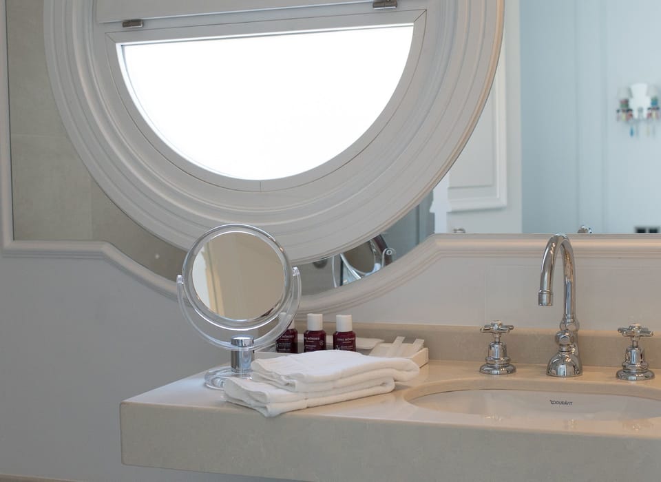 Bathroom | Designer toiletries, hair dryer, bathrobes, slippers