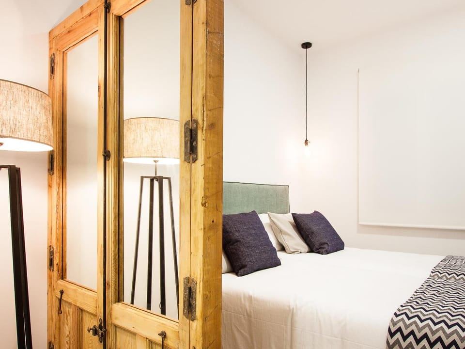 Premium bedding, desk, laptop workspace, blackout drapes