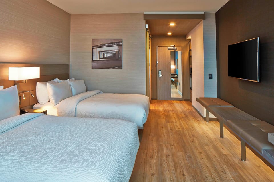 Premium bedding, pillowtop beds, desk, laptop workspace