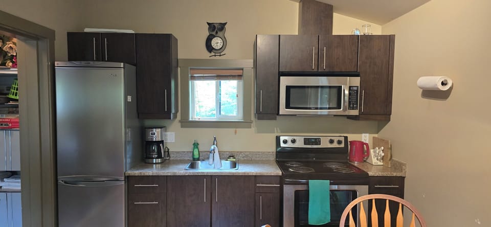 Full fridge/freezer, stove/oven microwave, SS coffee maker, knives and sharpener