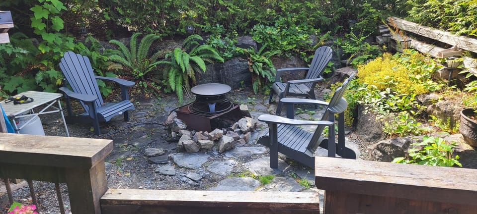 Completely private fire pit with propane stove for fire bans. Comfy chairs