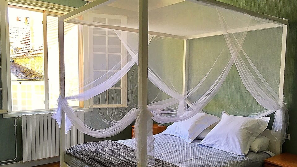 Bedroom 2 with King sized four poster bed.