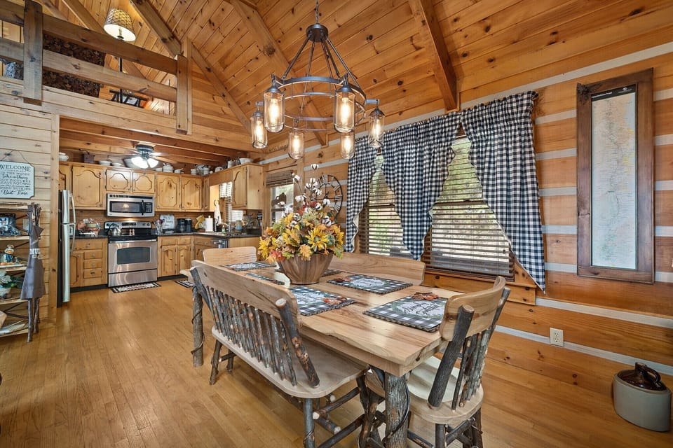 Large farmhouse table and benches provide plenty of dining space.