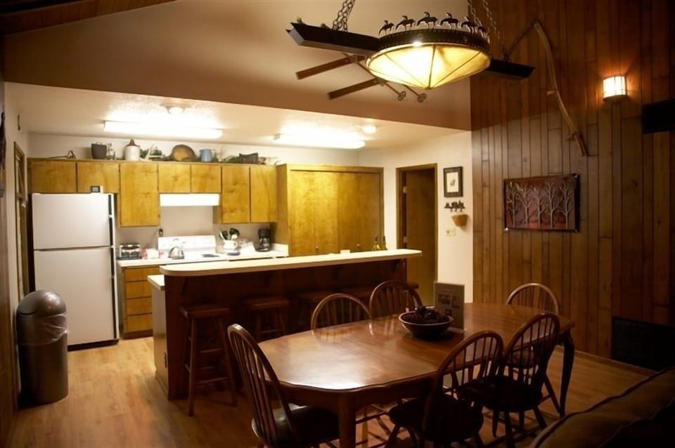 Large open kitchen with a breakfast bar that seats five