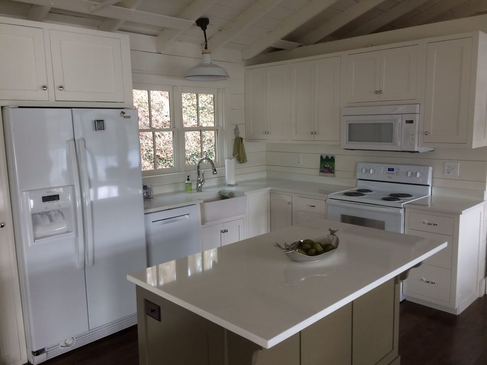Our fully stocked kitchen showing the refrigerator, washer, stove and microwave.