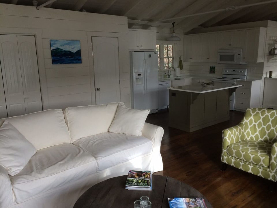 The living area showing the doors to the laundry and half bath