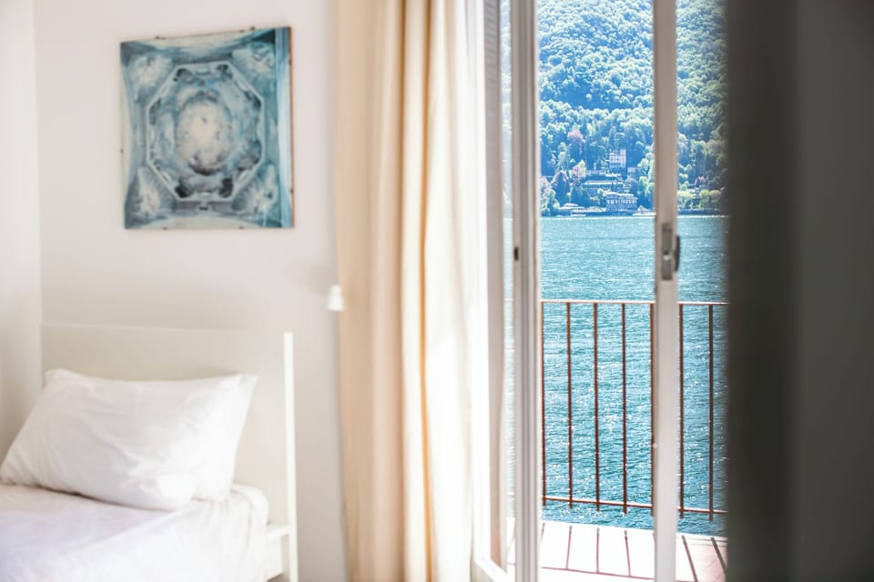Panoramic Room, Private Bathroom, Lake View | Individually decorated, individually furnished, desk, blackout drapes
