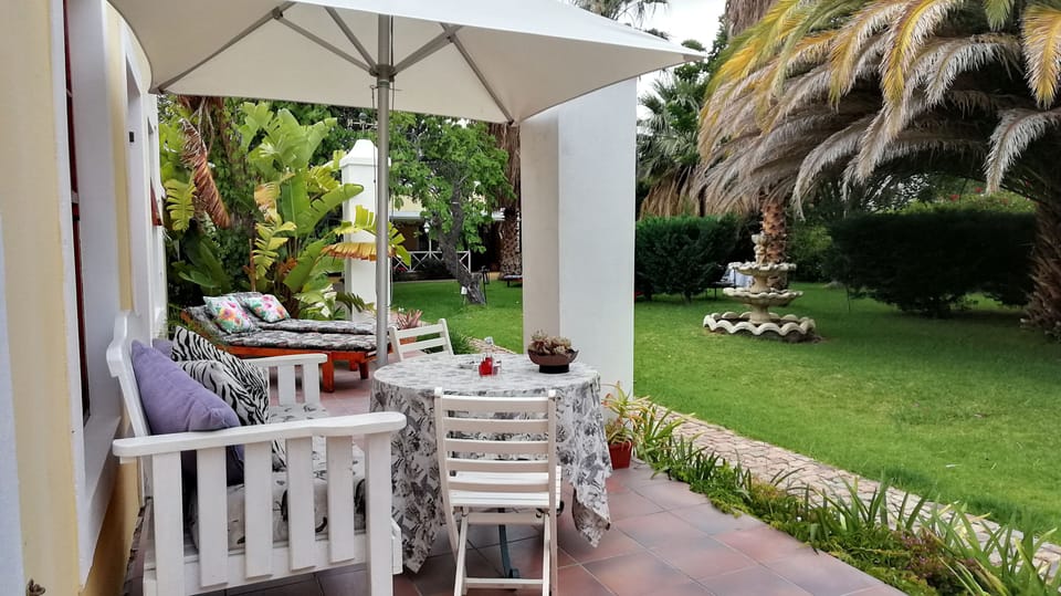 Suite with garden view | Terrace/patio