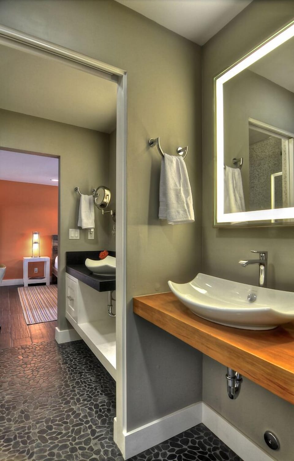 Pocket door dividend 2 vessek sinks.  Shower w/ one sink; toilet w/ other sink.