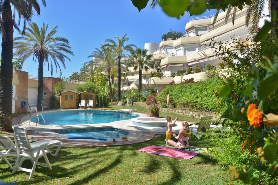 1st swiming pool, green area, our penthouse in on the left