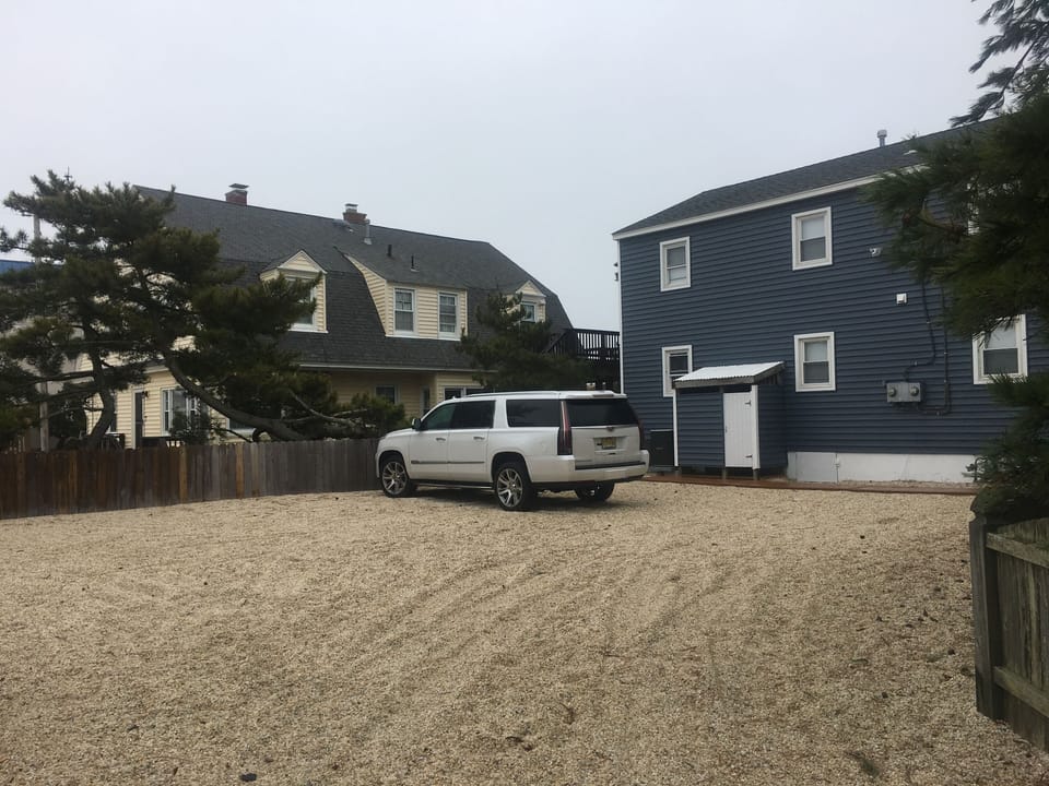 Large parking lot fits four cars easily!