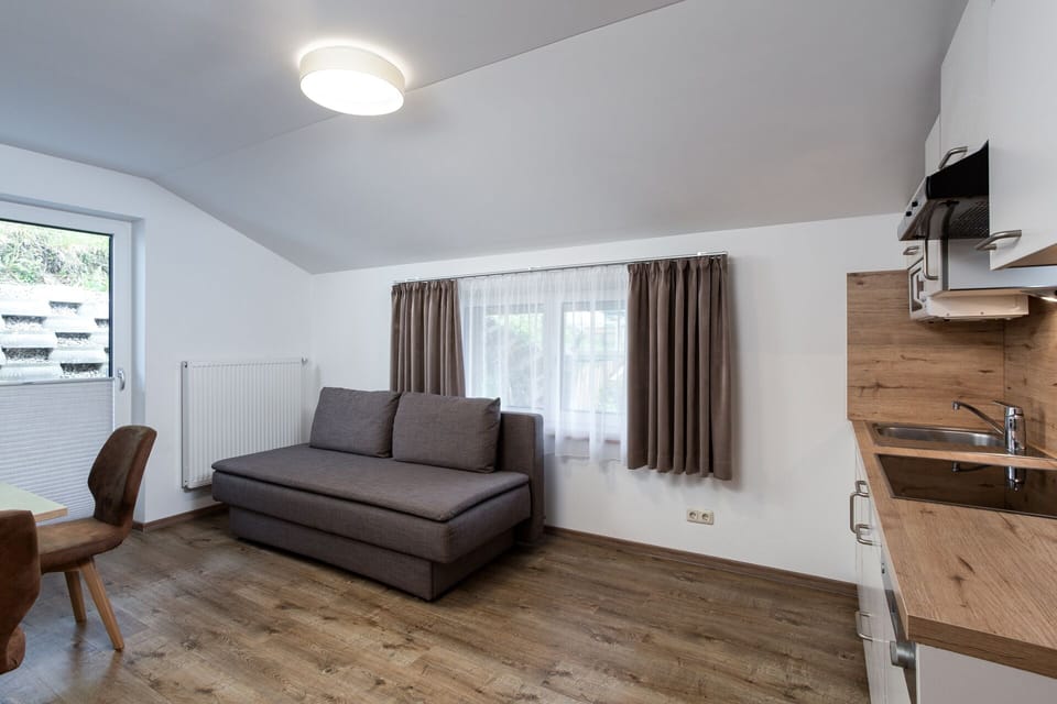 Comfort Apartment, 1 Bedroom, Kitchen, Garden View | Living area | Smart TV, heated floors, offices
