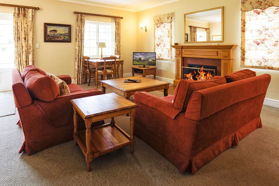 Deluxe Cottage | Living area | 32-inch Smart TV with digital channels