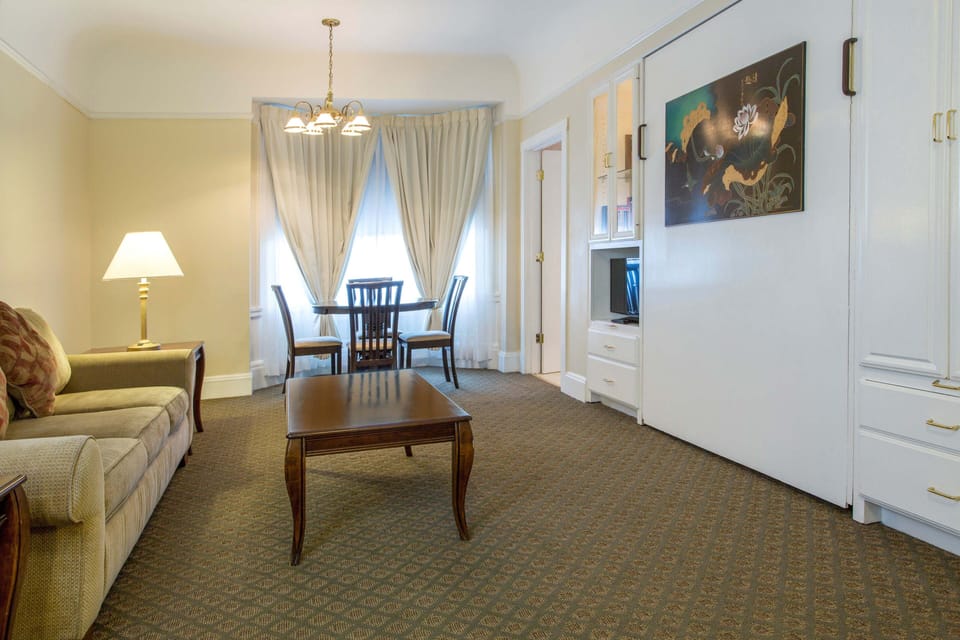 Suite with Kitchen, 2 Queen + Murphy Bed | Living room | 30-inch flat-screen TV with satellite channels, TV