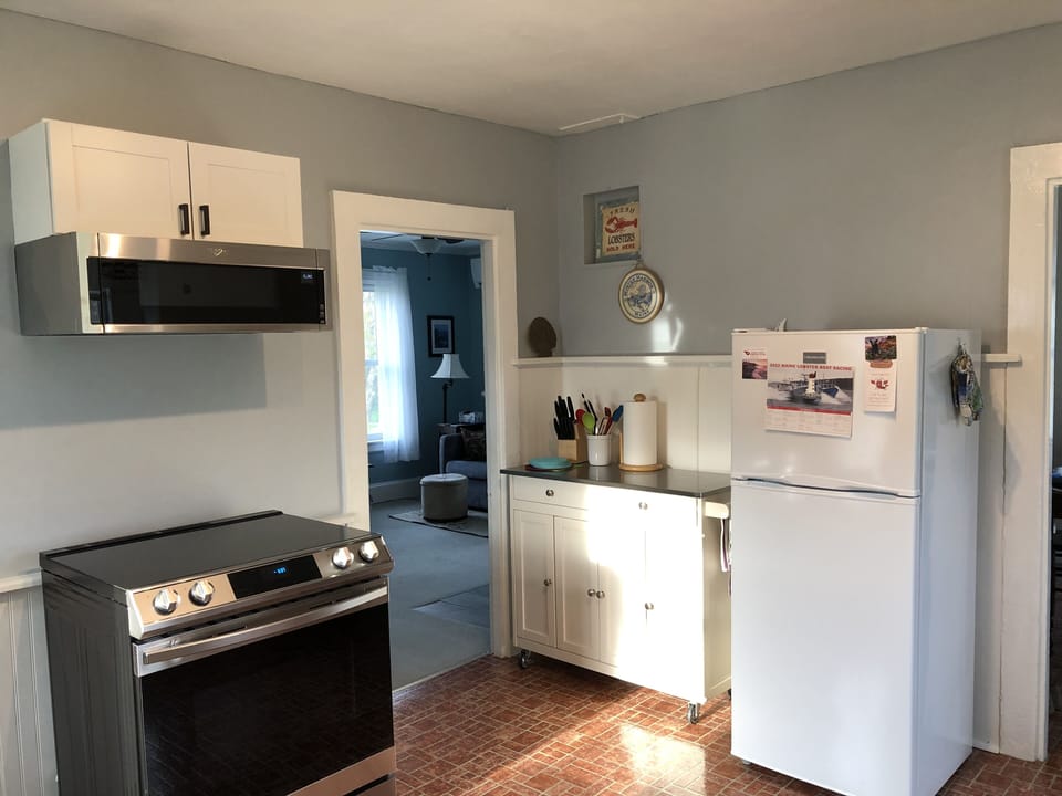 Kitchen-Partial View w/Electric Range & Microwave, Refrigerator, 4 SliceToaster