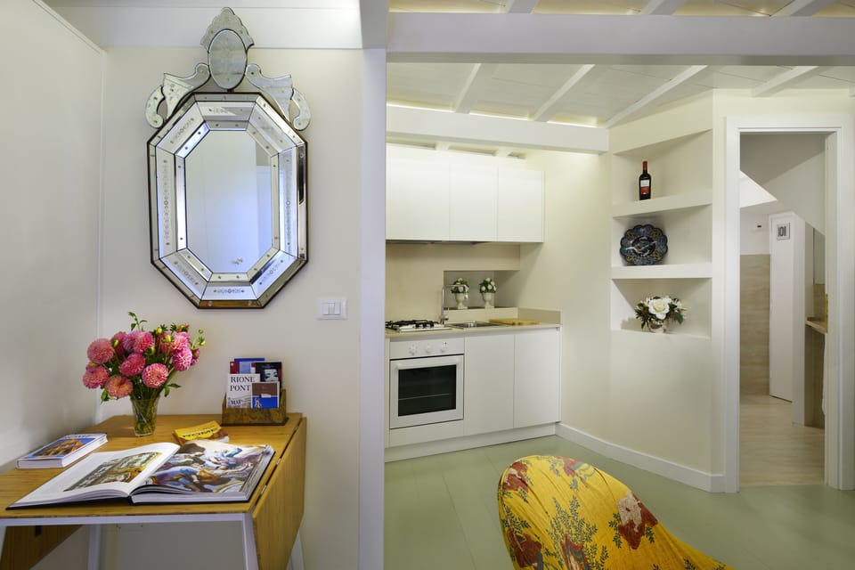 The entrance of the apartment with a view of the kitchen.
