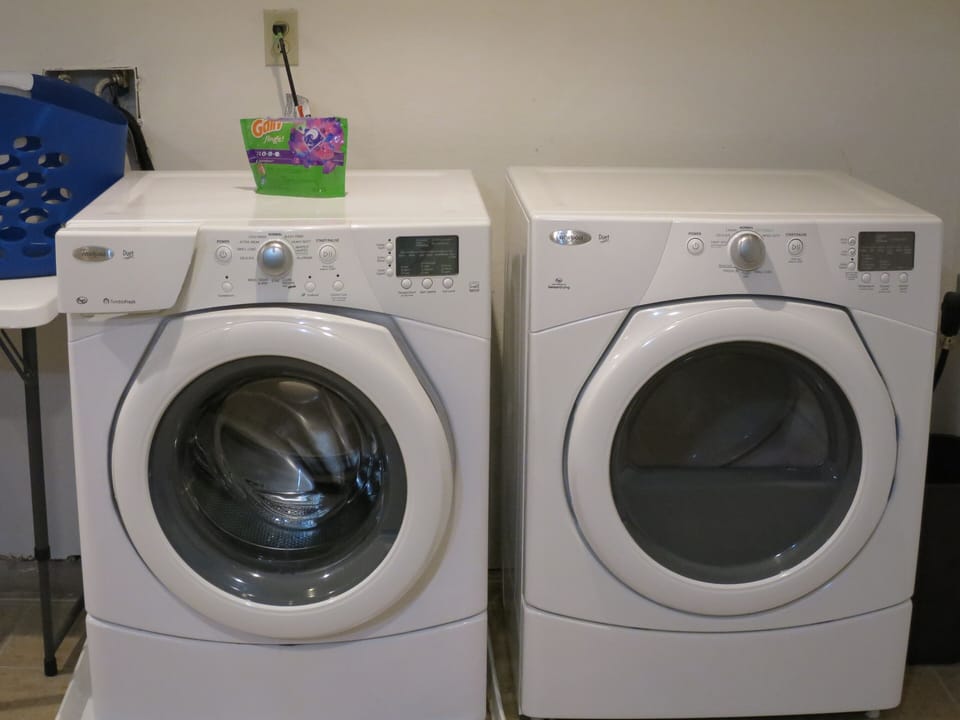 HIGH-EFFICIENCY WASHER AND DRYER ARE LOCATED IN THE BASEMENT AREA