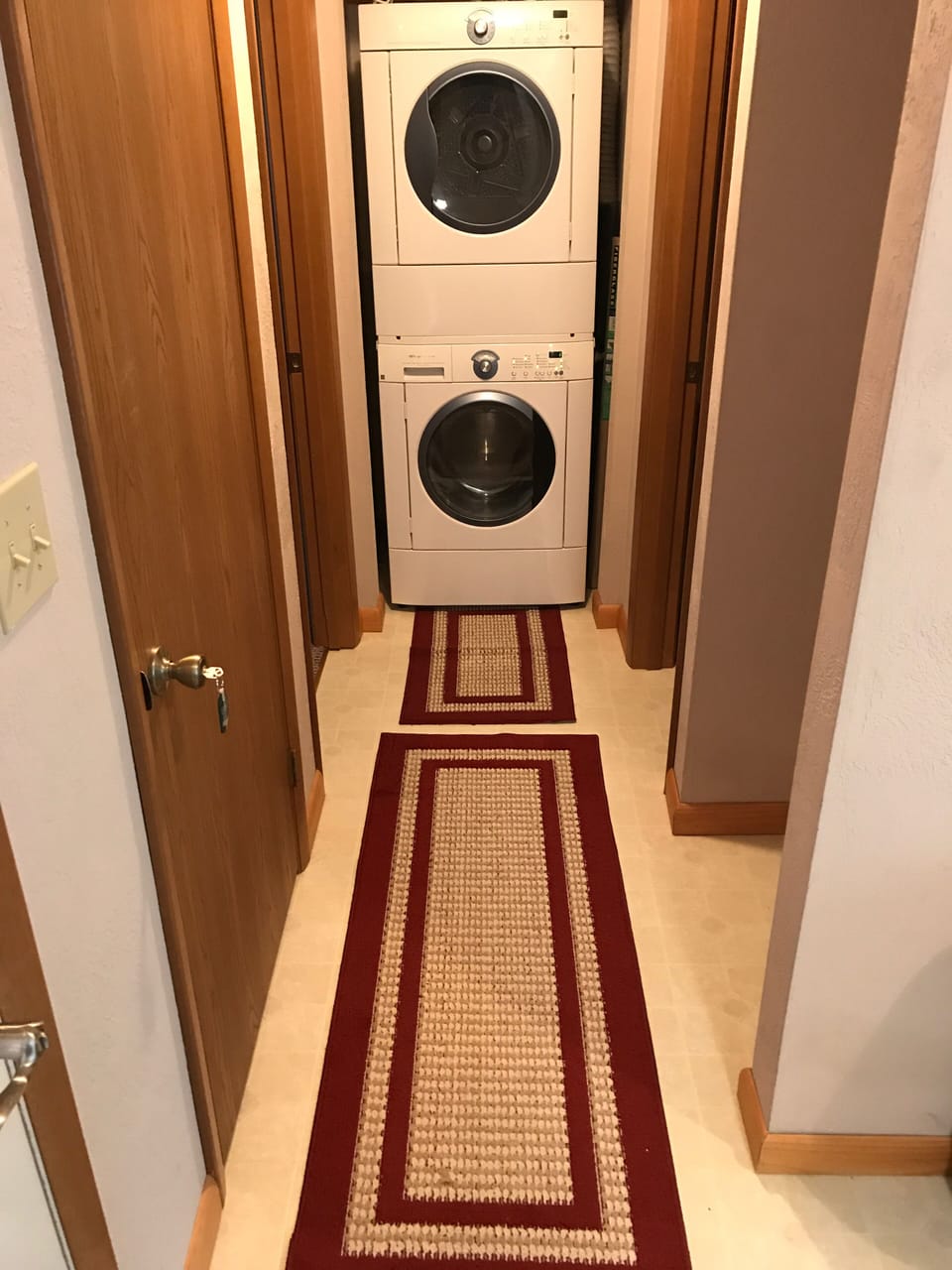Stackable Washer/Dryer, hallway storage, and linen closet. (Detergent provided)