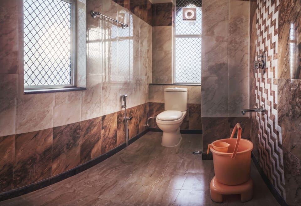 Shower, designer toiletries, hair dryer, slippers