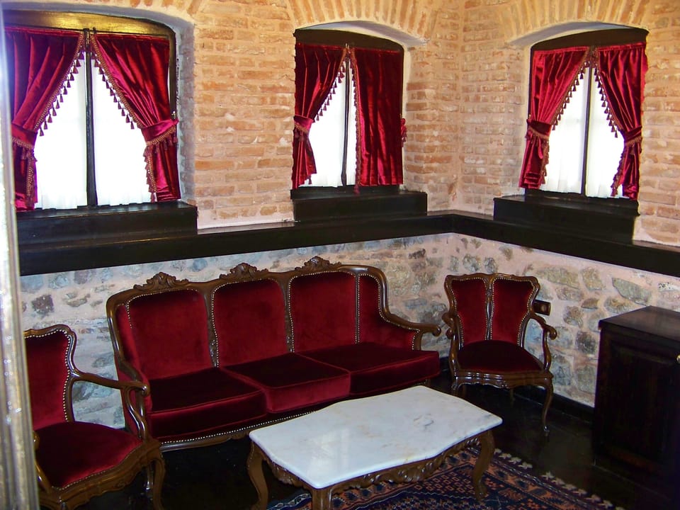 Premium Suite, 1 King Bed | Living room | 23-inch LED TV with satellite channels, TV