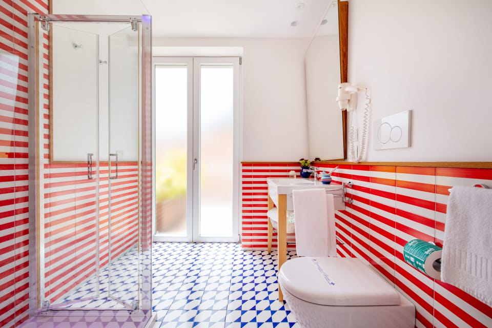 Deluxe Double or Twin Room, Balcony, Partial Sea View | Bathroom | Shower, free toiletries, hair dryer, bidet