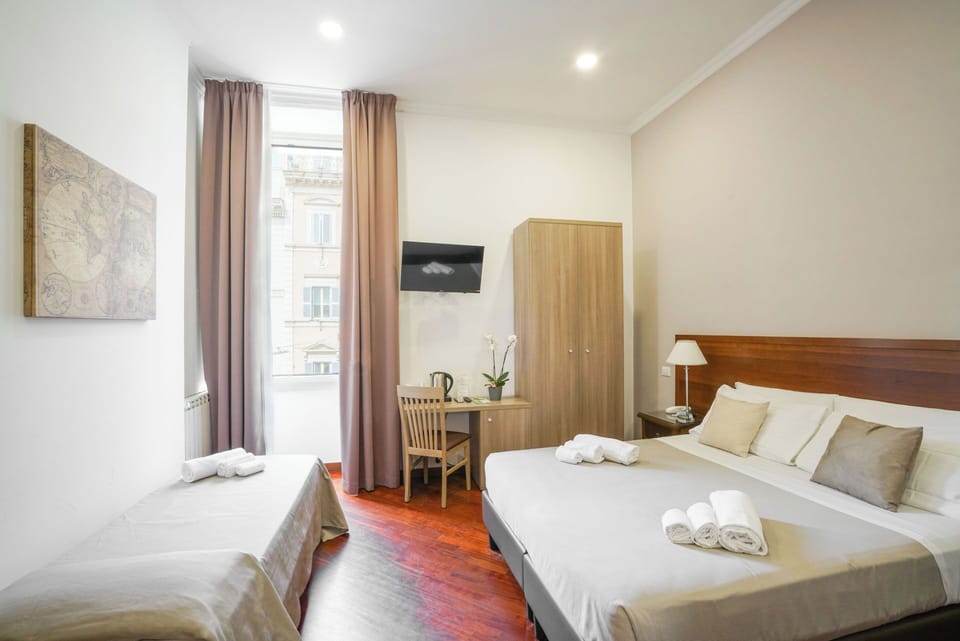 Quadruple Room | Minibar, in-room safe, desk, iron/ironing board
