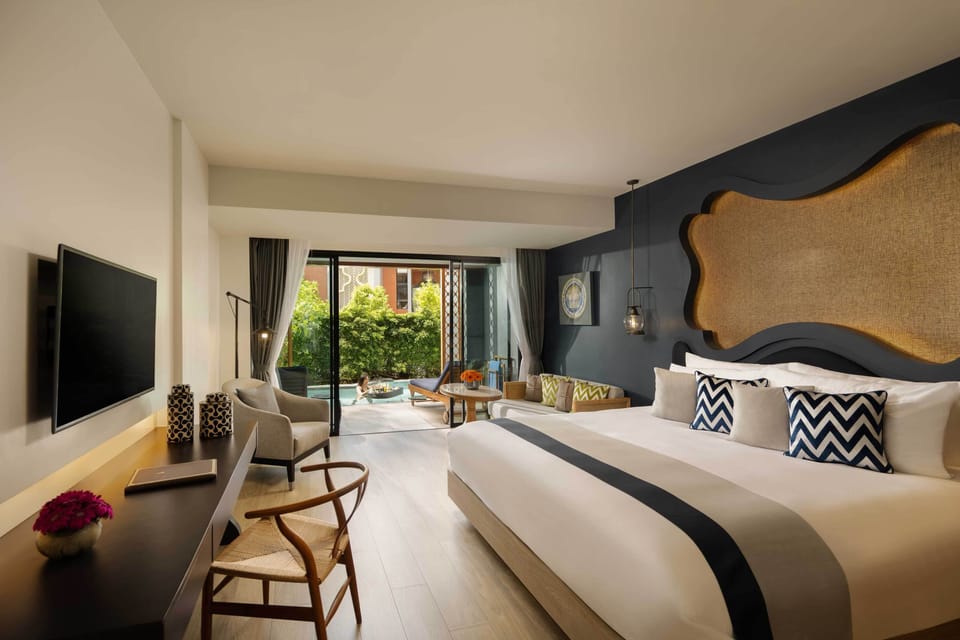 Deluxe Suite, 1 King Bed, Pool Access, Garden View | Premium bedding, down comforters, minibar, in-room safe