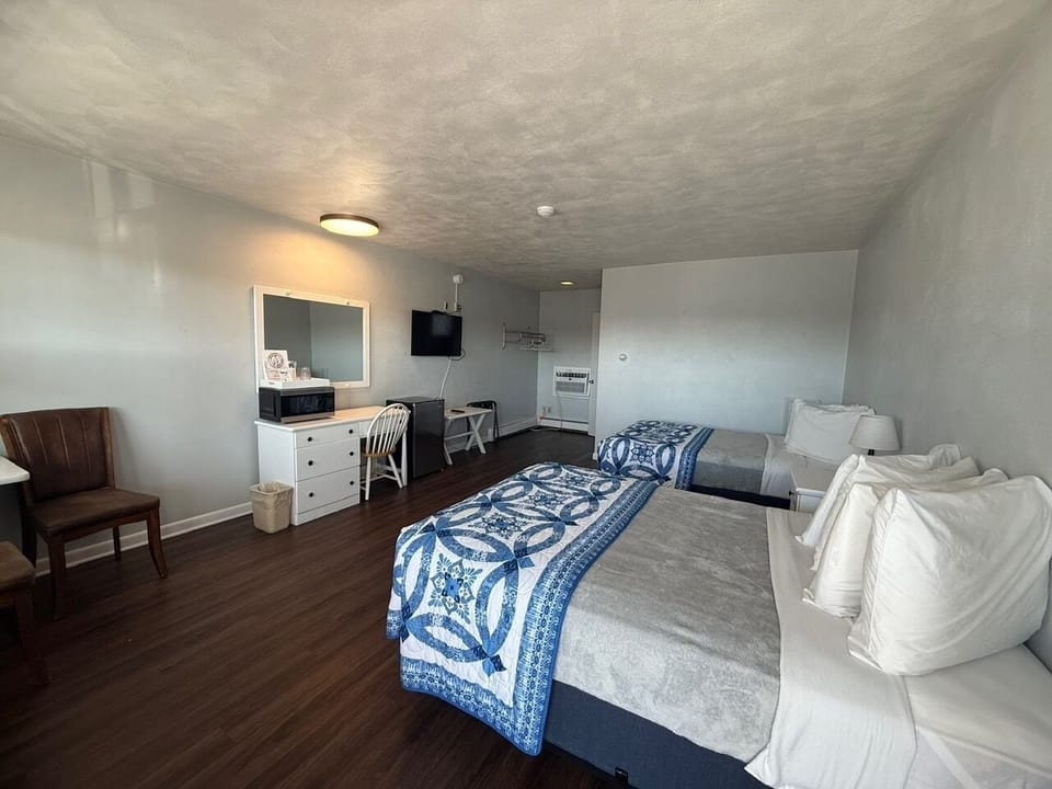 Desk, laptop workspace, blackout drapes, iron/ironing board