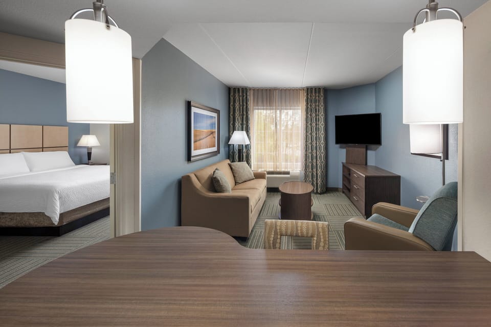 Suite, 1 Bedroom | Desk, blackout drapes, iron/ironing board, free cribs/infant beds