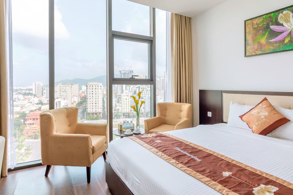 Deluxe Triple Room, Beach View, Beachfront | Minibar, in-room safe, desk, blackout drapes