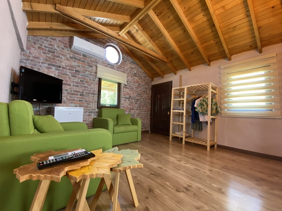 Family Twin Room | Minibar, in-room safe, iron/ironing board, free WiFi