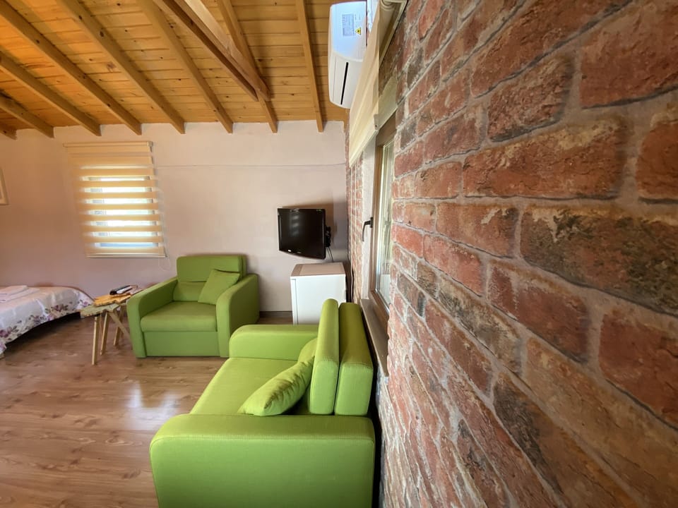 Family Twin Room | Living area | Flat-screen TV