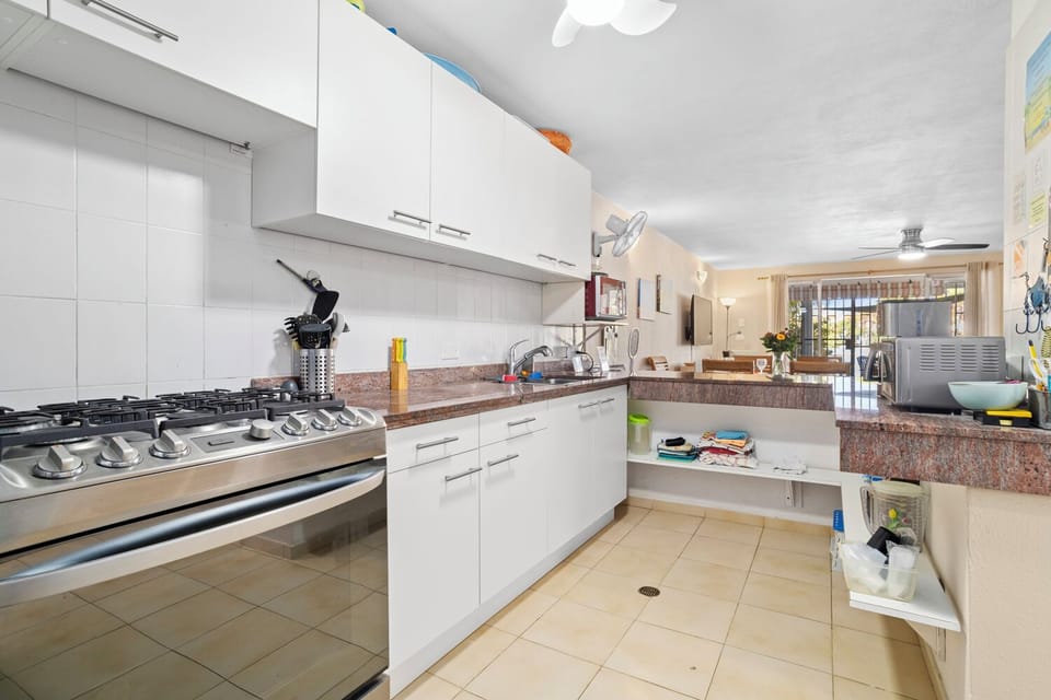 Full kitchen with 6 burner stove and oven, full size refrigerator