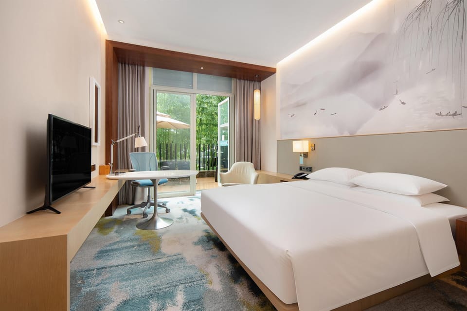 Room, 1 King Bed (Courtyard) | Premium bedding, in-room safe, desk, blackout drapes
