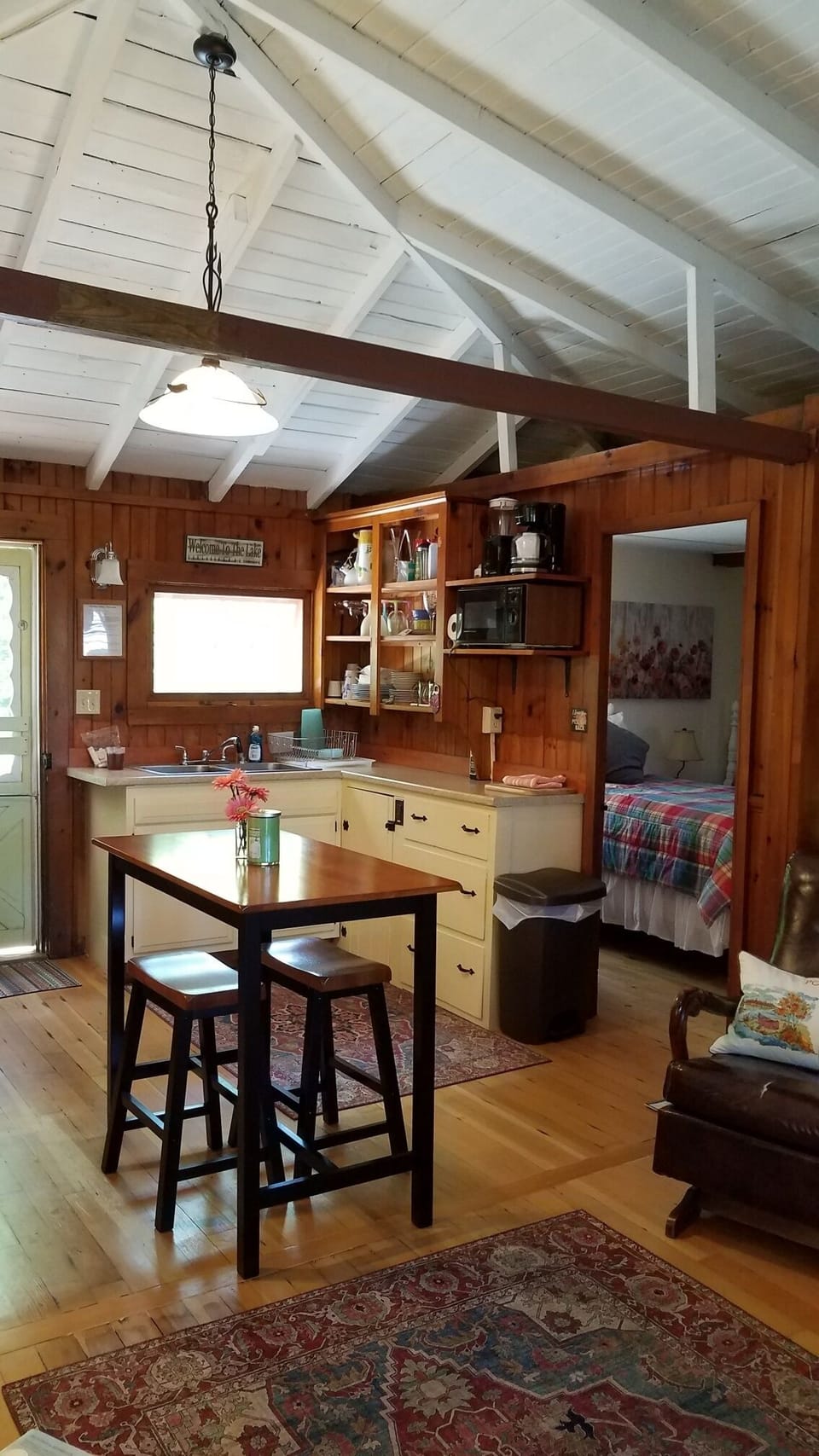 Kitchen/living area.  Table offers seating or room for dinner prep.