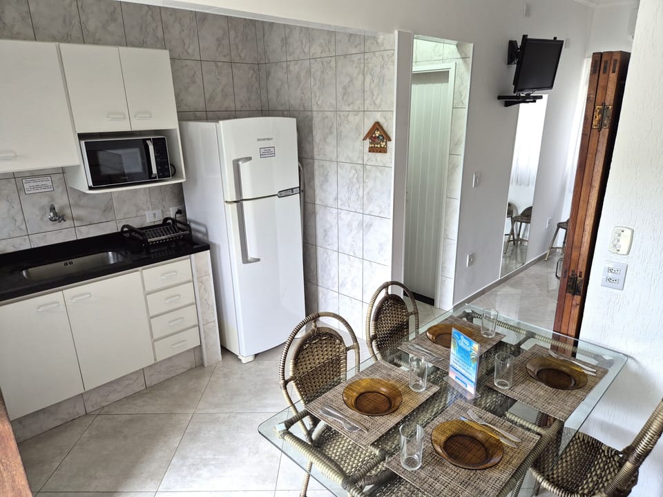 Apartment (06-C) | Private kitchen | Fridge, microwave, oven, cookware/dishes/utensils