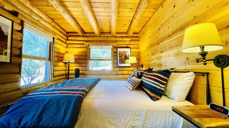 Downstairs Master Bedroom - King size bed with fluffy comforter and pillows   