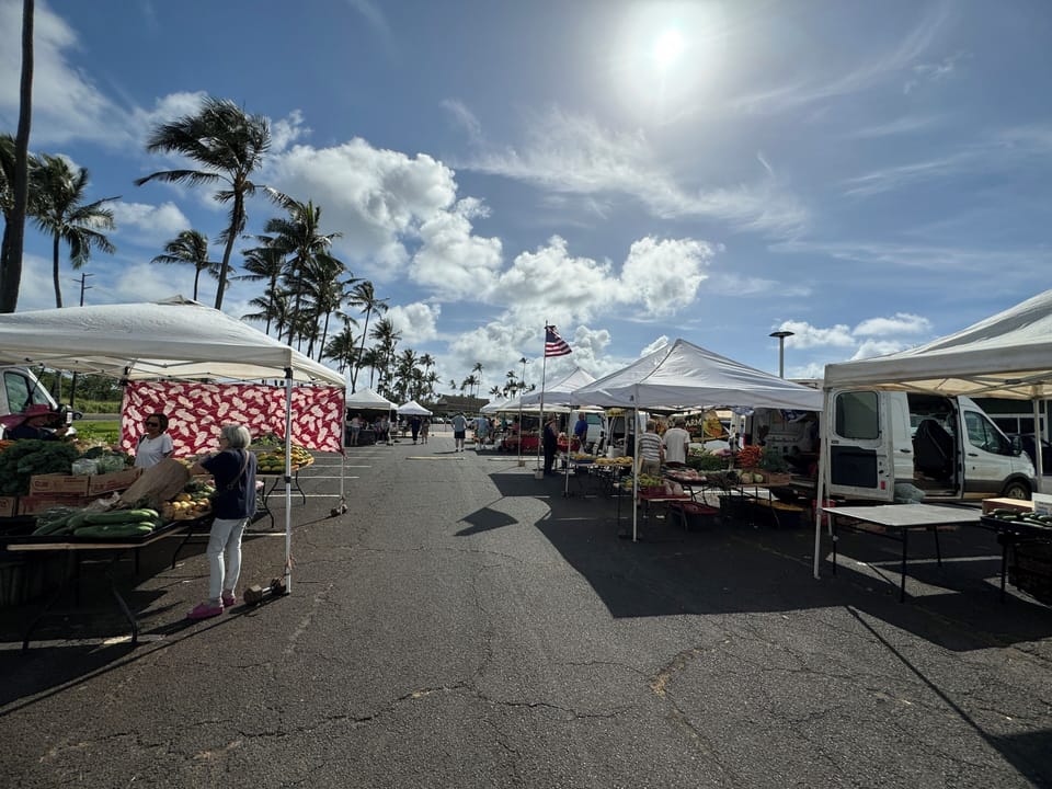 Experience Kauai's bounty at the Coconut Marketplace Farmers Market, featuring local fruits, vegetables, and unique artisan products every Tuesday and Thursday from 9 AM to 1 PM.