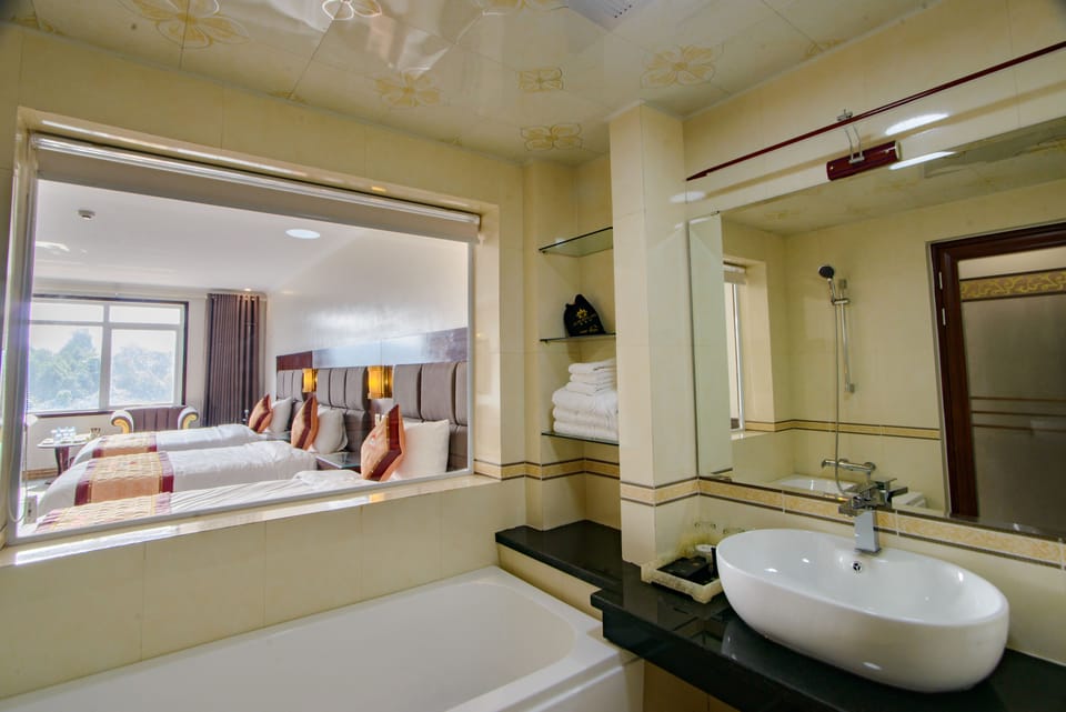 Triple Room | Bathroom | Combined shower/tub, deep soaking tub, eco-friendly toiletries