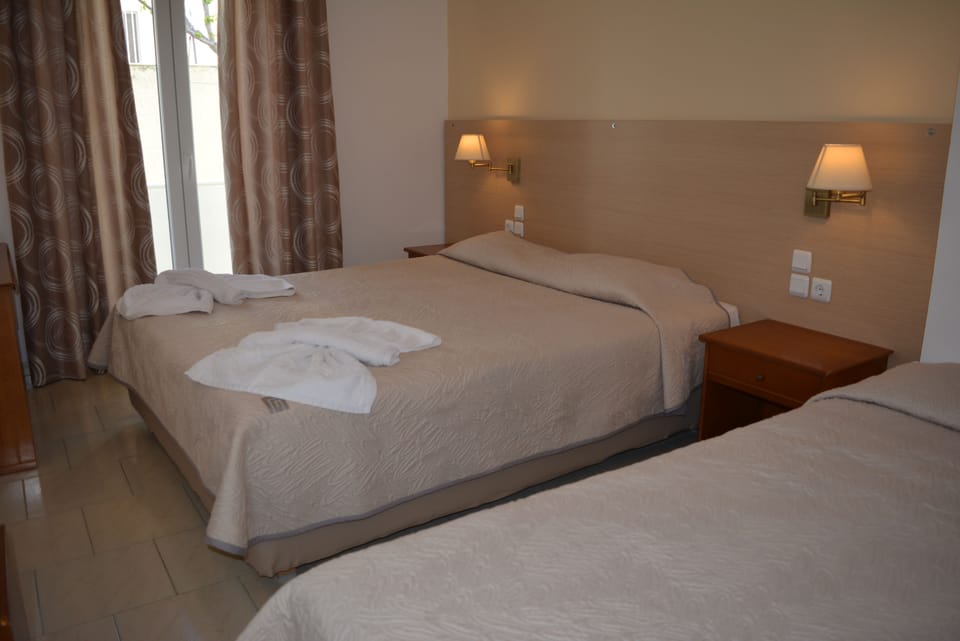 Standard Triple Room, Multiple Beds | In-room safe, blackout drapes, iron/ironing board, free WiFi