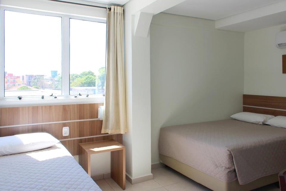Deluxe Triple Room | Minibar, desk, blackout drapes, soundproofing