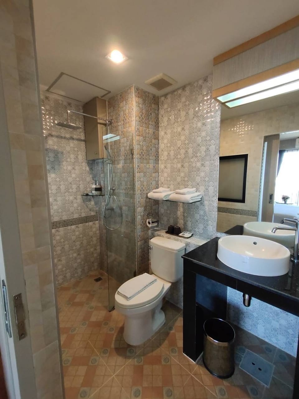 Shower, free toiletries, slippers, towels